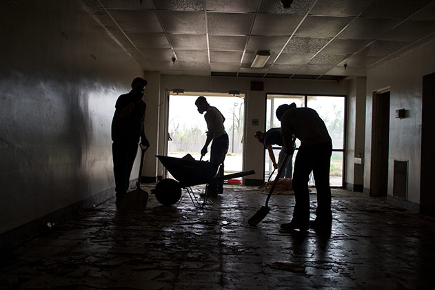 Work crew cleaing up a school in New Orleans after Hurricane Katrina.